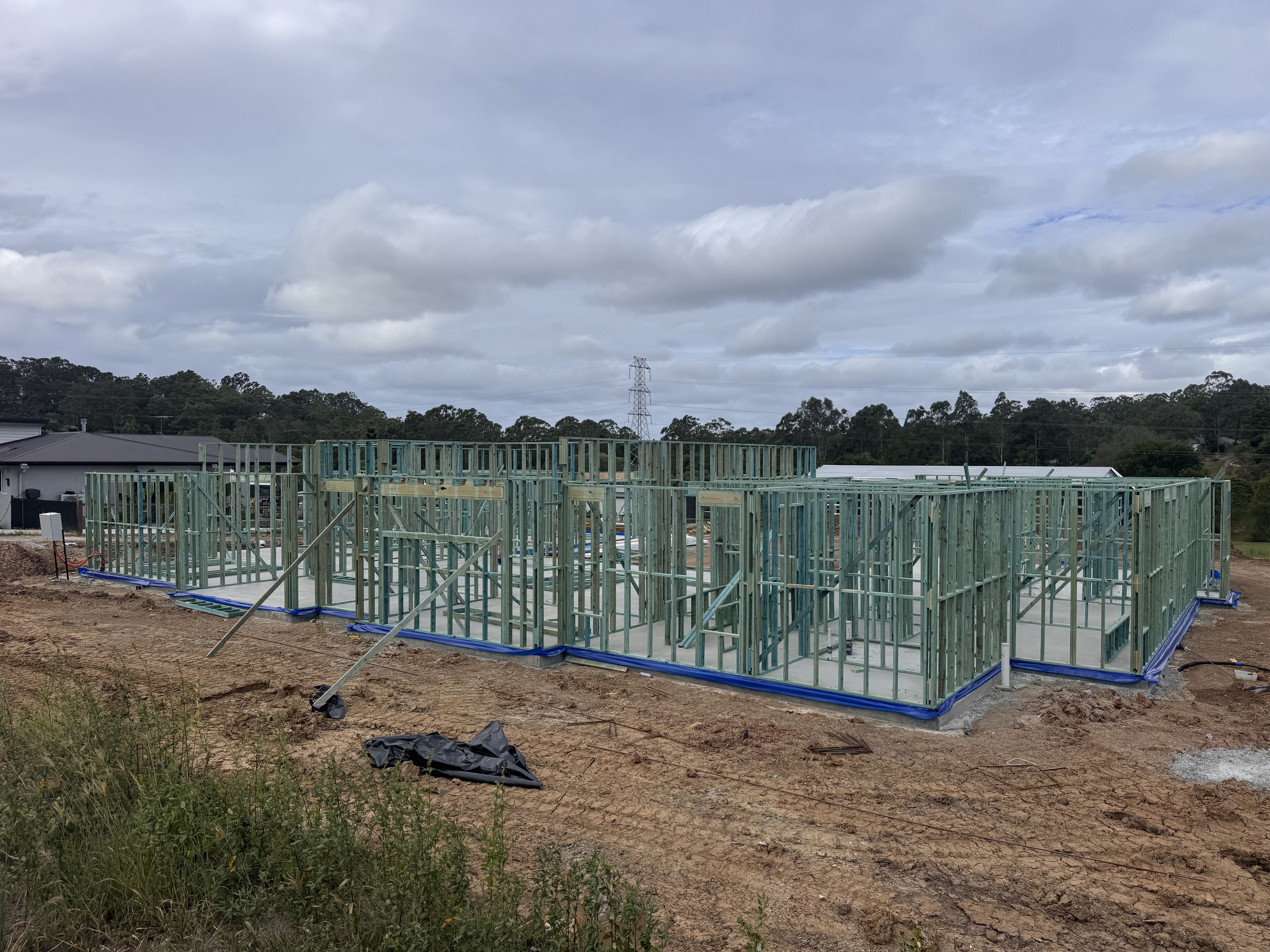 Ripple Construction team on site reviewing plans